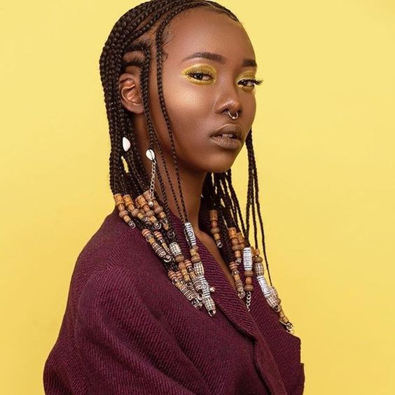 braids with intricately designed wooden beads