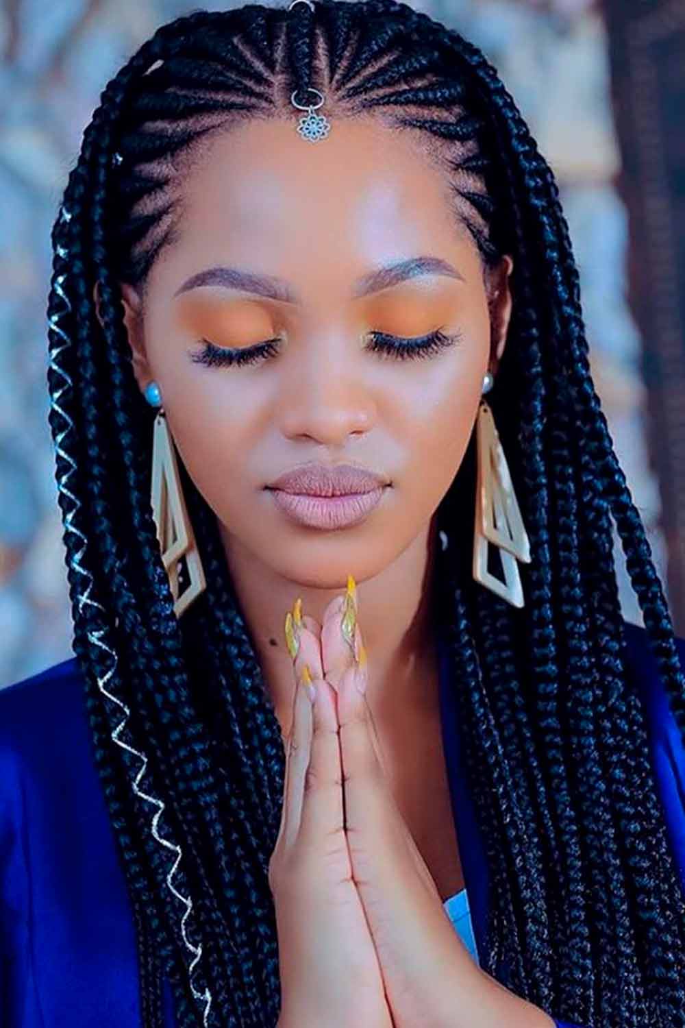 Fulani braids adorned with wire and jewels